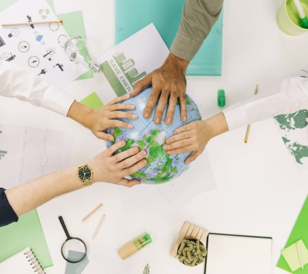 group-businesspeople-placing-their-hands-globe group-businesspeople-placing-their-hands-globe
