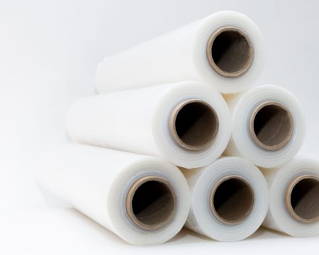Transparent stretch film in rolls on a white background Transparent stretch film in rolls on a white background. High quality photo